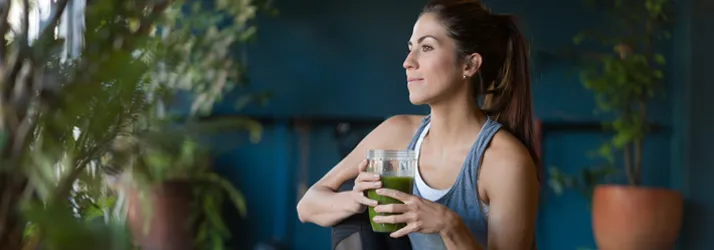 Chiropractic Snellville GA Healthy Woman Yoga with Green Smoothie